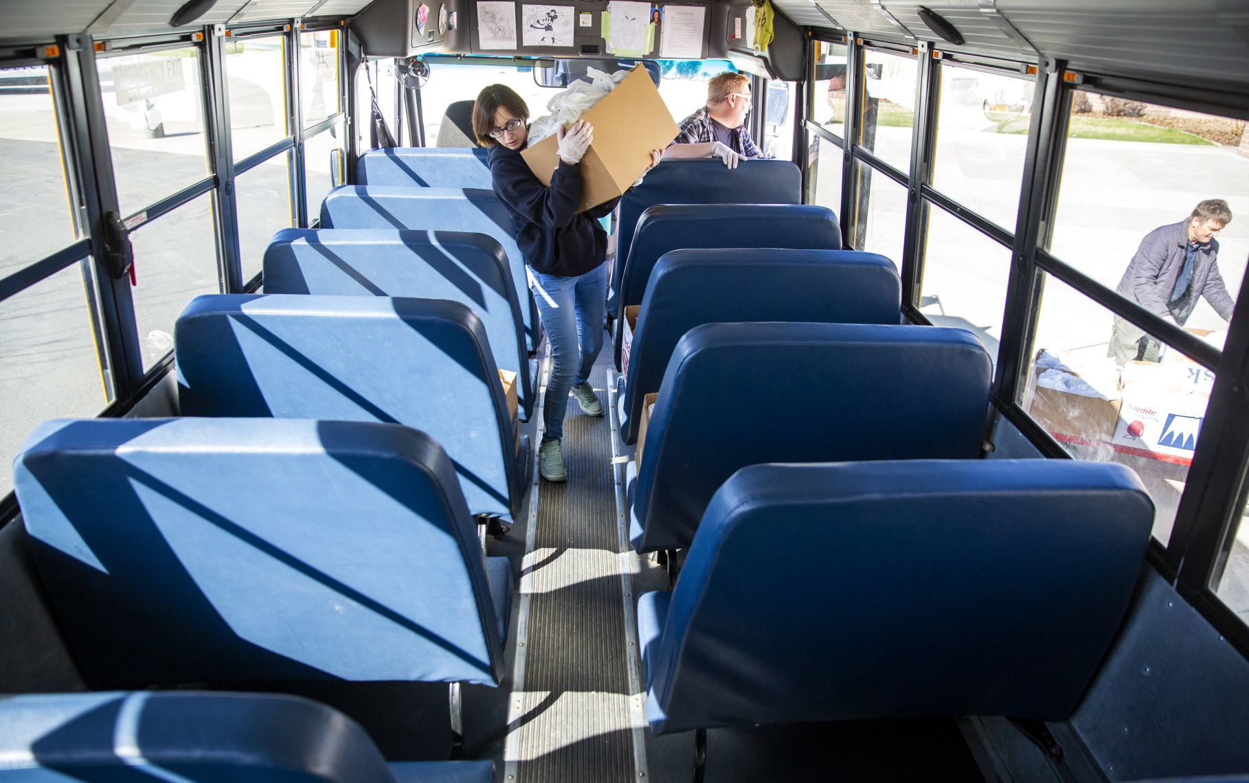 Bus drivers deliver food to students